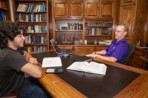 Dr. Kenny Stephens's office hours are always attended with students seeking advice.